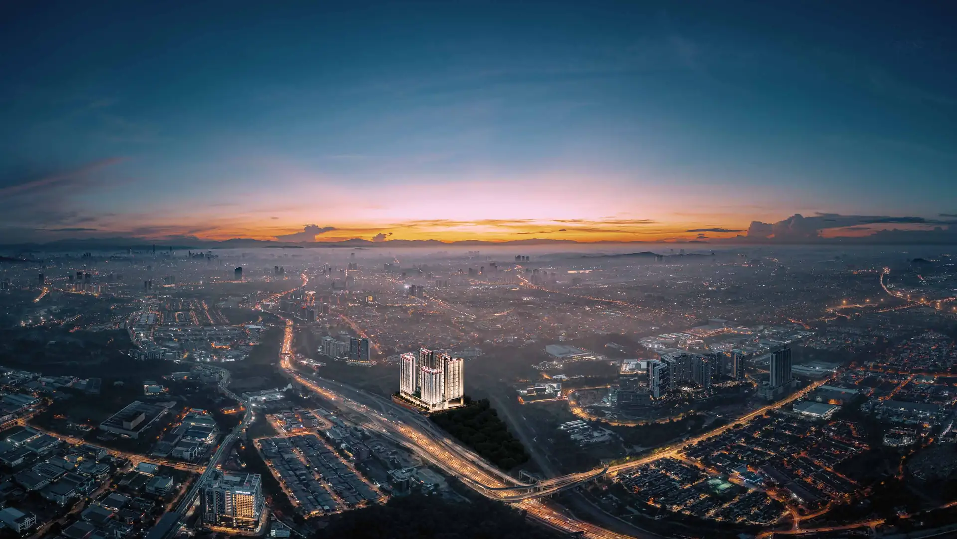Aerial view at dusk of Subang Jaya with Luminar Residence beside the Federal Highway